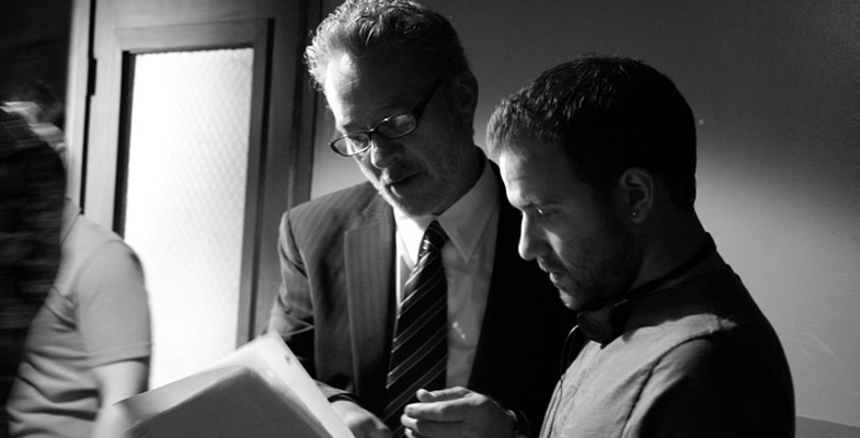 Charles Adelman and Mark Thompson going over script notes between takes
